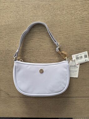 lululemon athletica Mini Shoulder Bag in Light Lavender with Gold Hardware